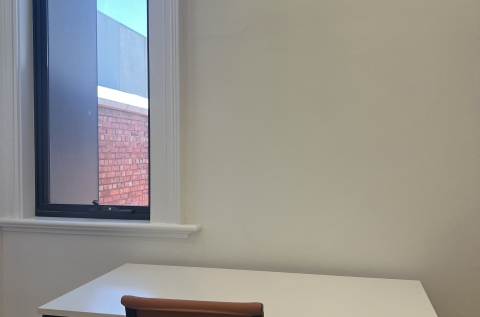 Desks and chairs provided.