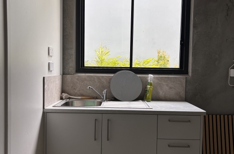 Kitchenette - more cupboards and space behind it